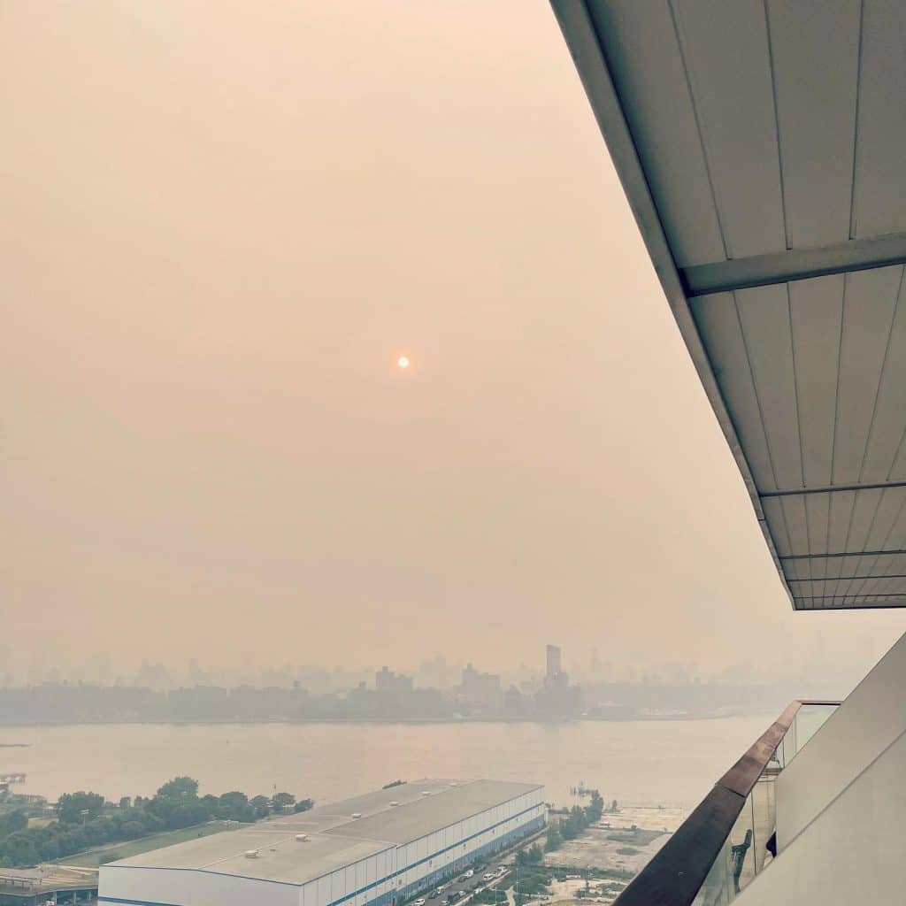The picturesque city skyline view obscured by smoke from Canadian wild fires